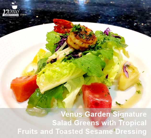 Venus Garden signature salad greens with tropical fruits and roasted prawn in toasted sesame dressing