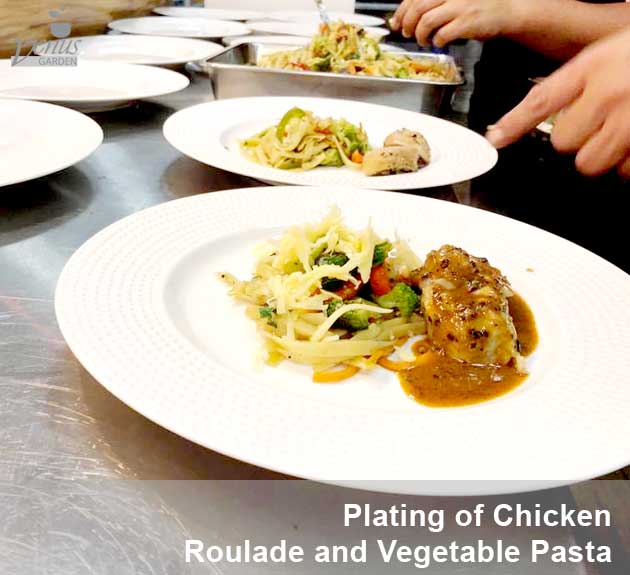 plating of chicken roulade and vegetable pasta